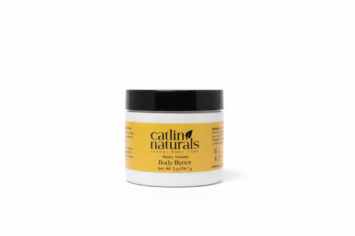 Catlin Naturals travel size body butter jar with yellow label on a white background