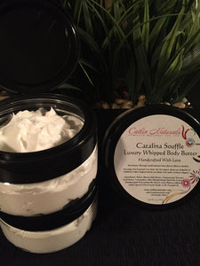clear jar of catalina souffle with black lid, white label , showing ingredients inside jar, lid off to the side of clear jar, body souffle body butter